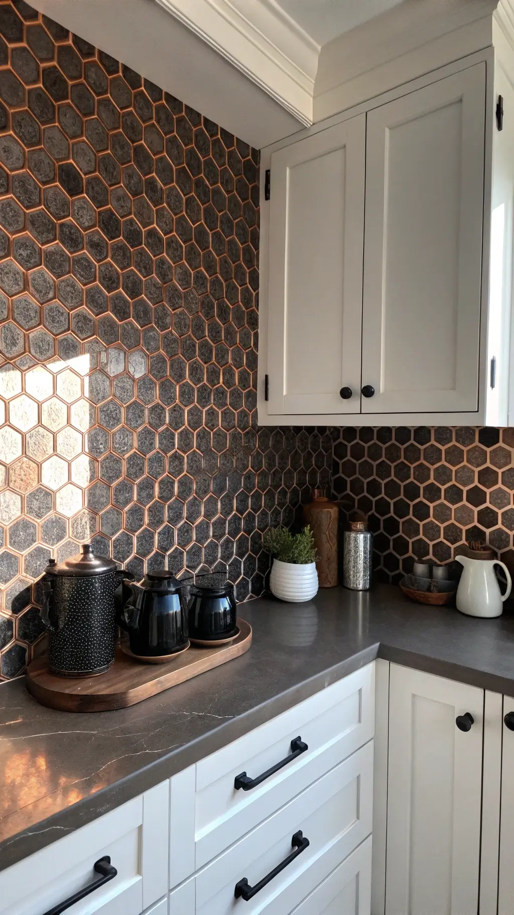 Bold geometric penny round mosaic in matte black and metallic copper in a corner kitchen nook with white shaker cabinets, under-cabinet lighting, and minimalist black ceramics and copper accessories, illuminated by afternoon sun.