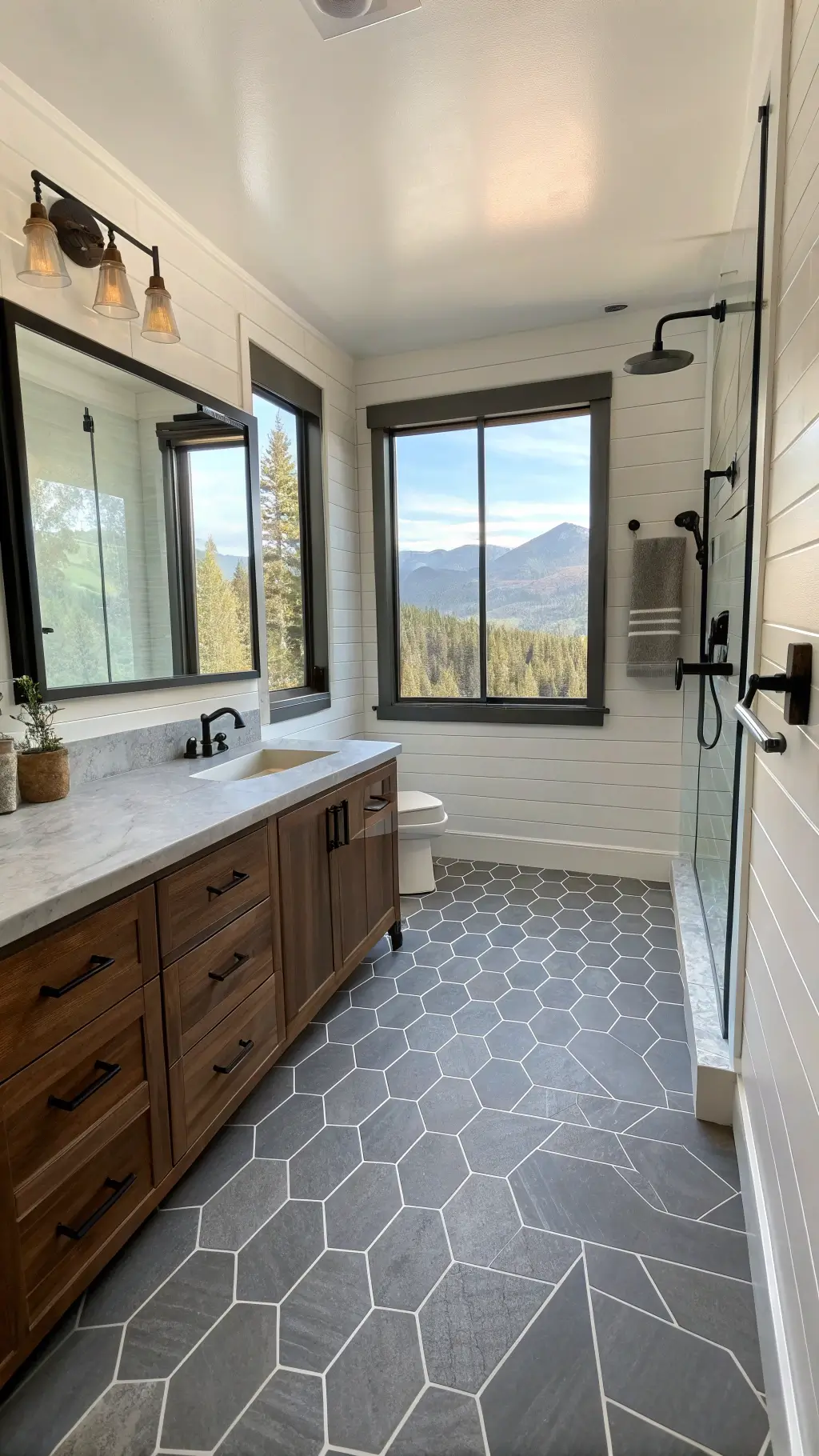 Modern 8x8ft bathroom with geometric gray slate flooring, dark-stained pine vanity, matte black fixtures, and mountain view through clerestory windows.